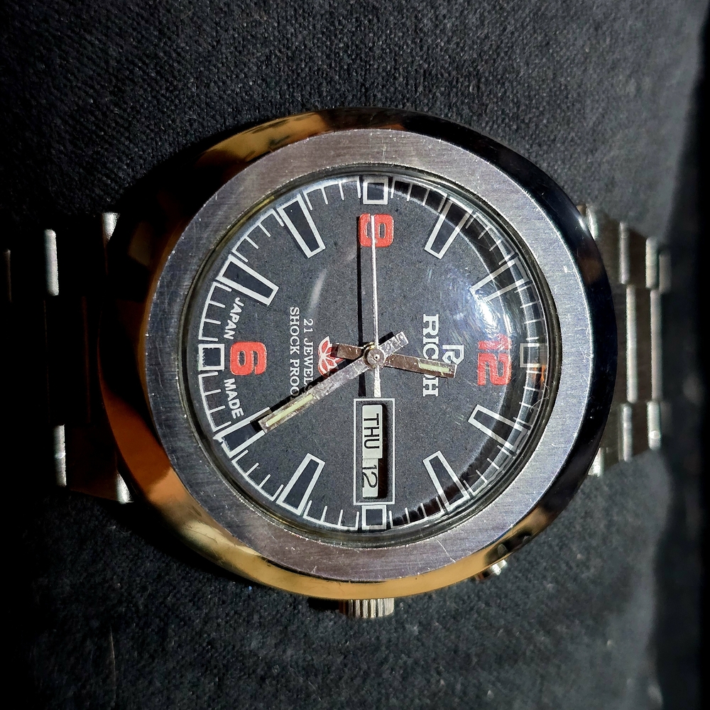 Richo Black and Silver Automatic Watch with Red Accents
